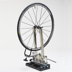 Wheel truing stand tilting base